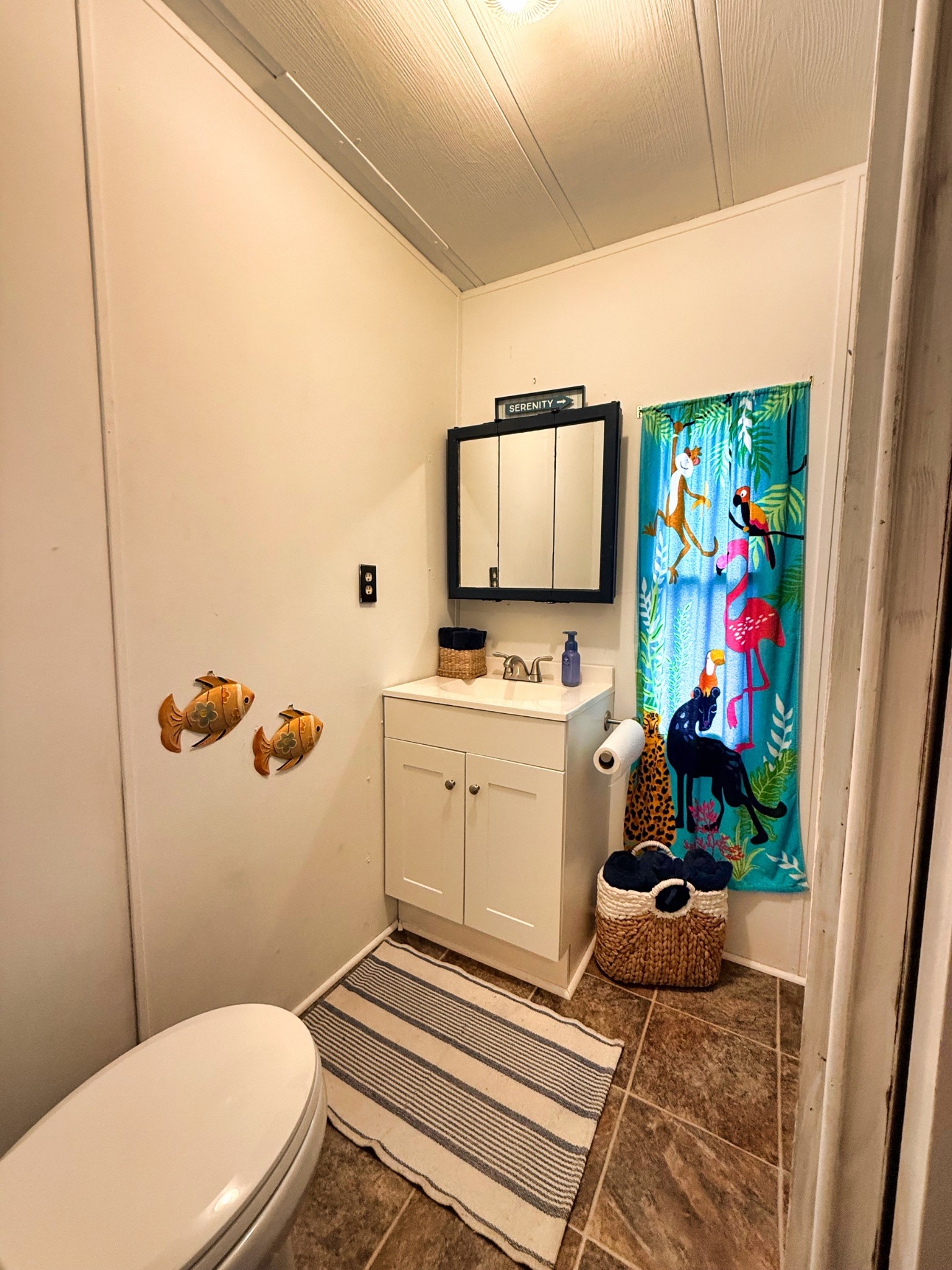 743 Brownfield Road Dover, TN 37058 - Photo 18 of 19 a bathroom with a toilet sink and mirror