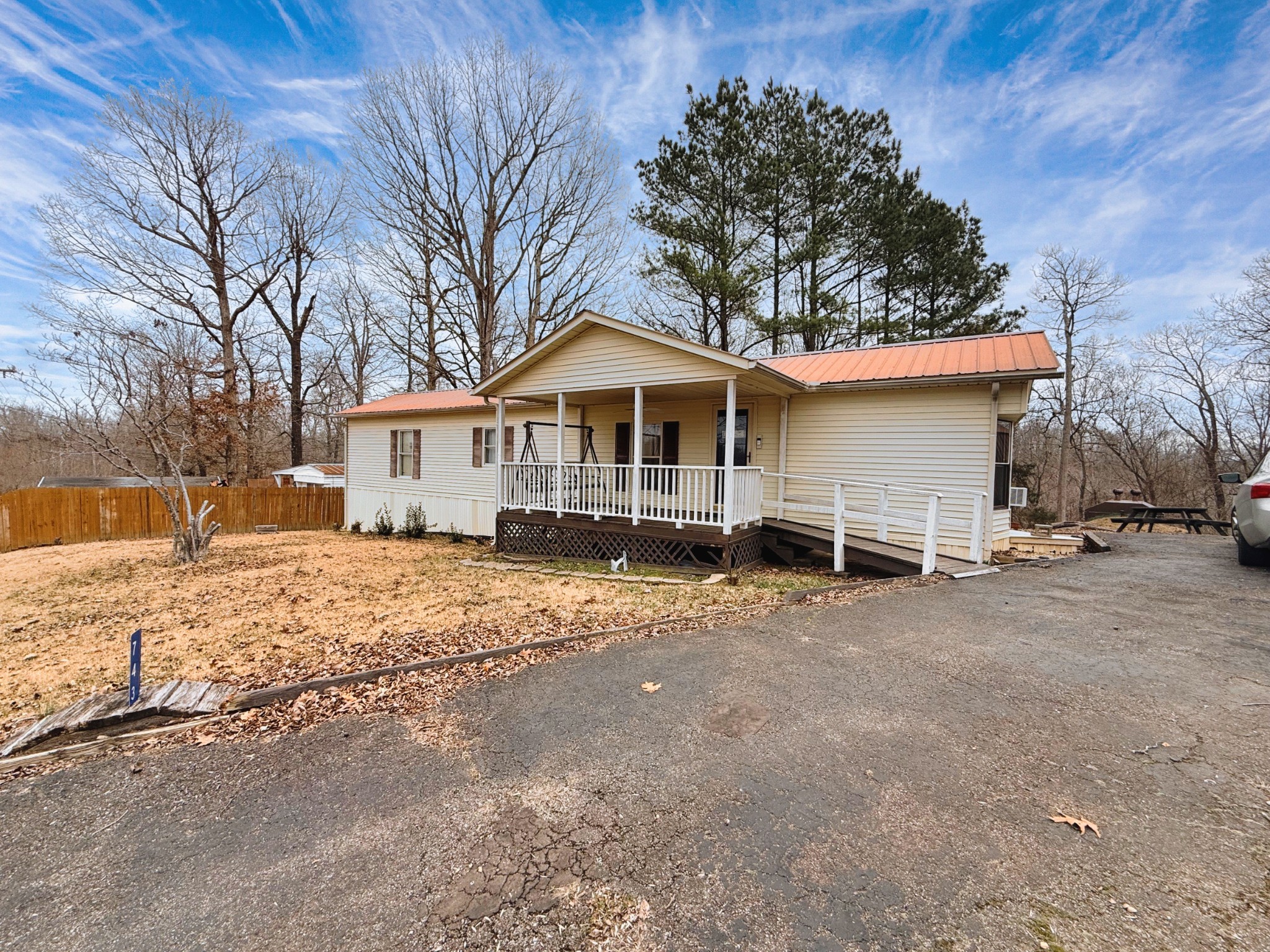 743 Brownfield Road Dover, TN 37058 - Photo 7 of 19 a front view of a house with a yard covered with snow