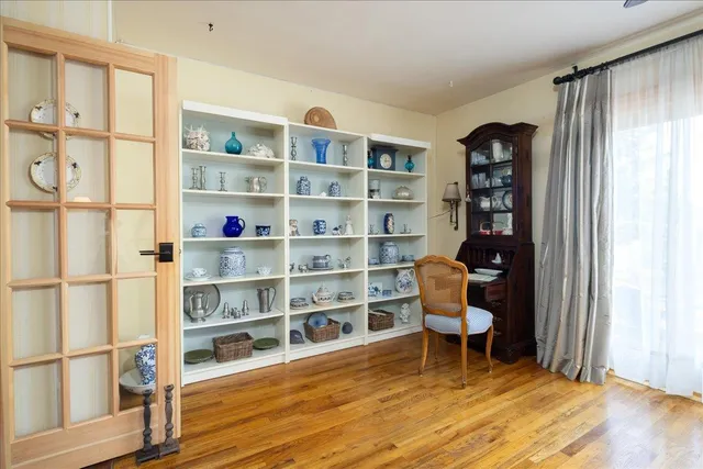 a room with furniture cabinets and a window