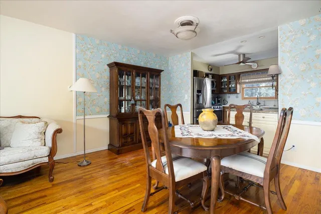 a dining room with furniture and window
