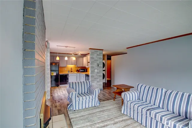 a bedroom with furniture and a rug