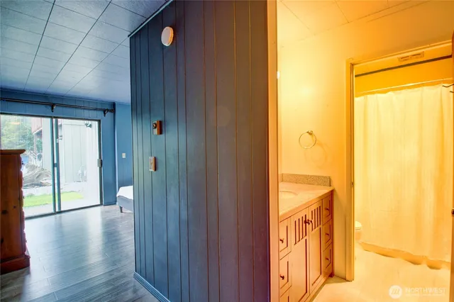 a bedroom with a large bed and a large window