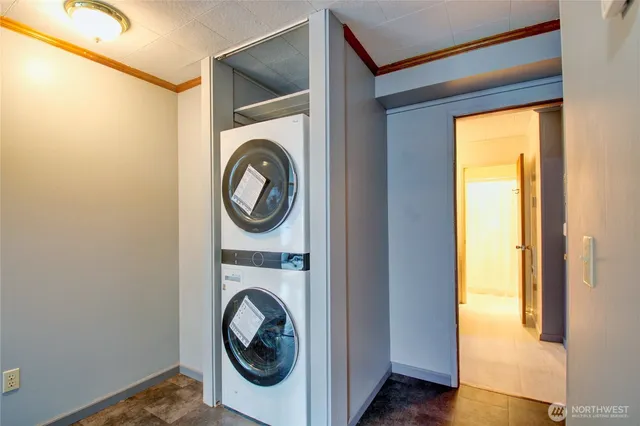 a view of a house with a yard and wooden fence
