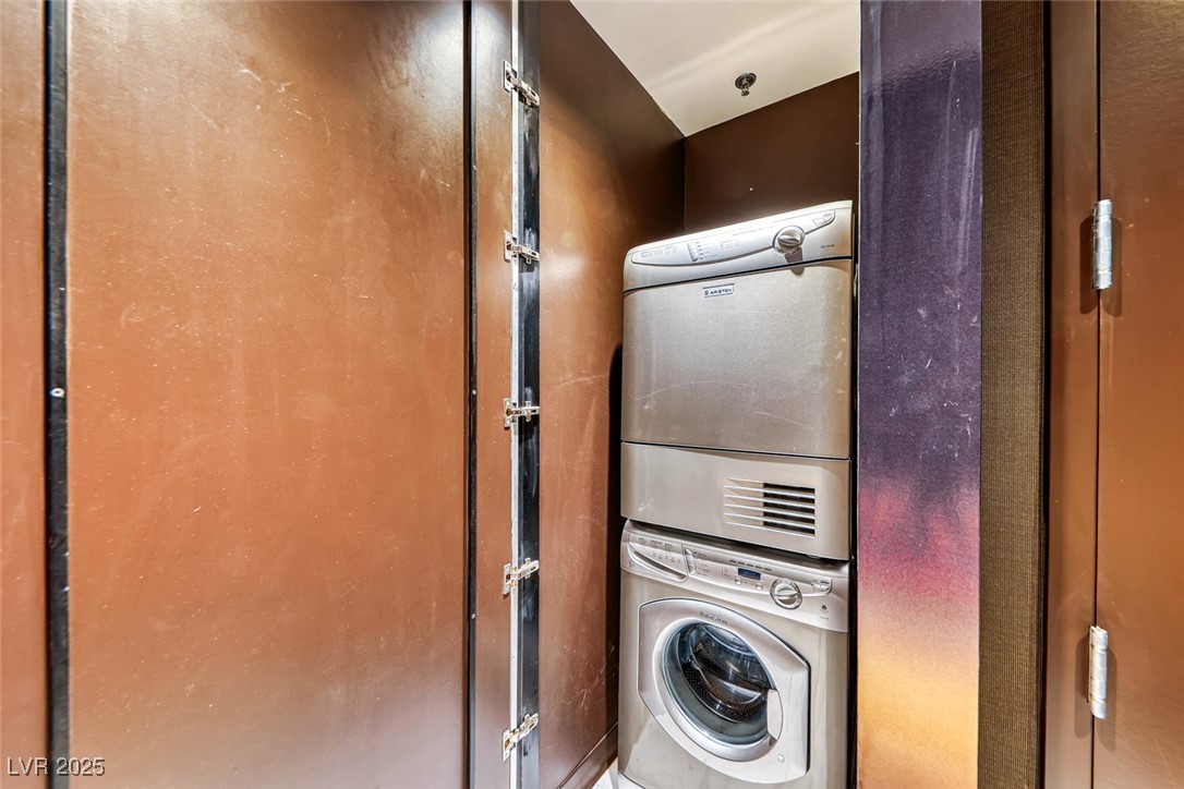 4381 West Flamingo Road, Unit 901 Las Vegas, NV 89103 - Photo 25 of 58 Washroom featuring stacked washer and clothes dryer