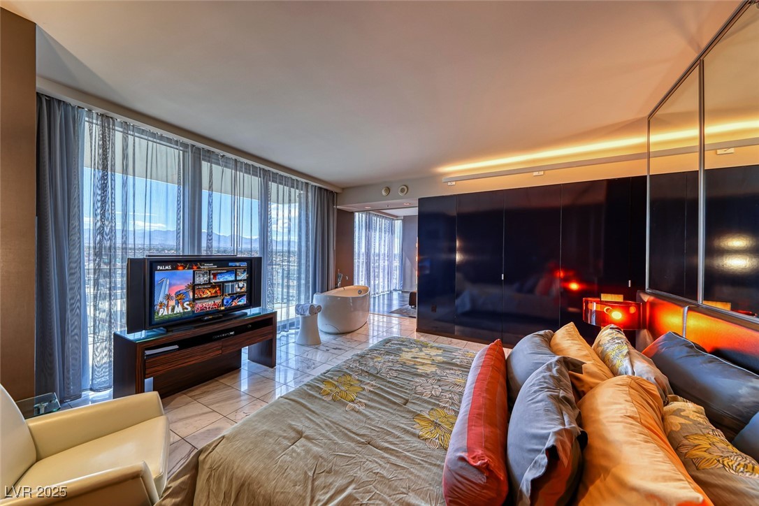 4381 West Flamingo Road, Unit 901 Las Vegas, NV 89103 - Photo 33 of 58 View of tiled bedroom