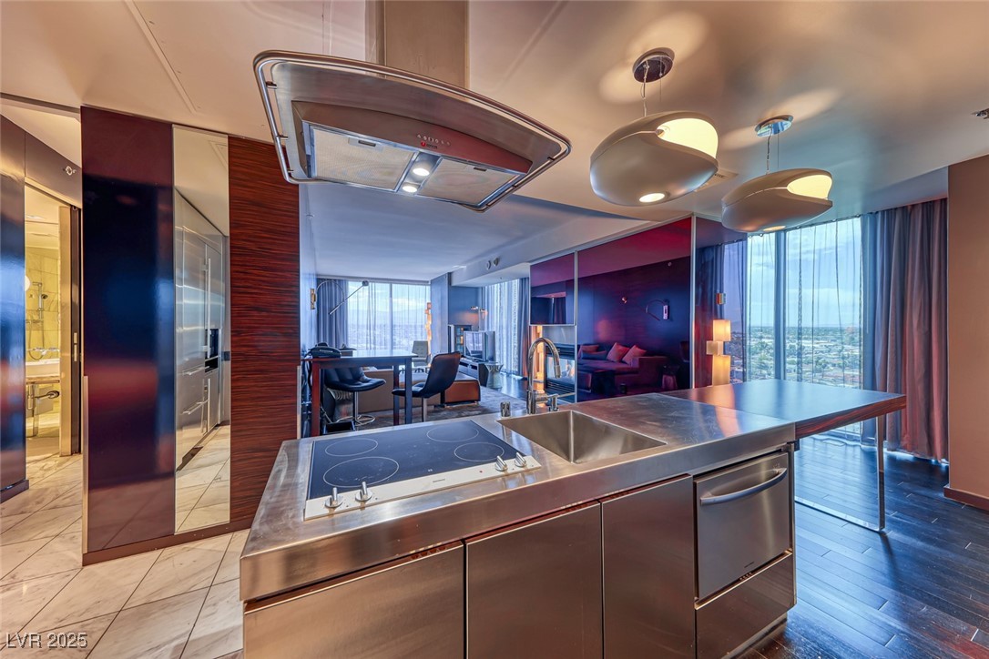4381 West Flamingo Road, Unit 901 Las Vegas, NV 89103 - Photo 58 of 58 Kitchen featuring stainless steel countertops, a sink, black electric cooktop, modern cabinets, and open floor plan