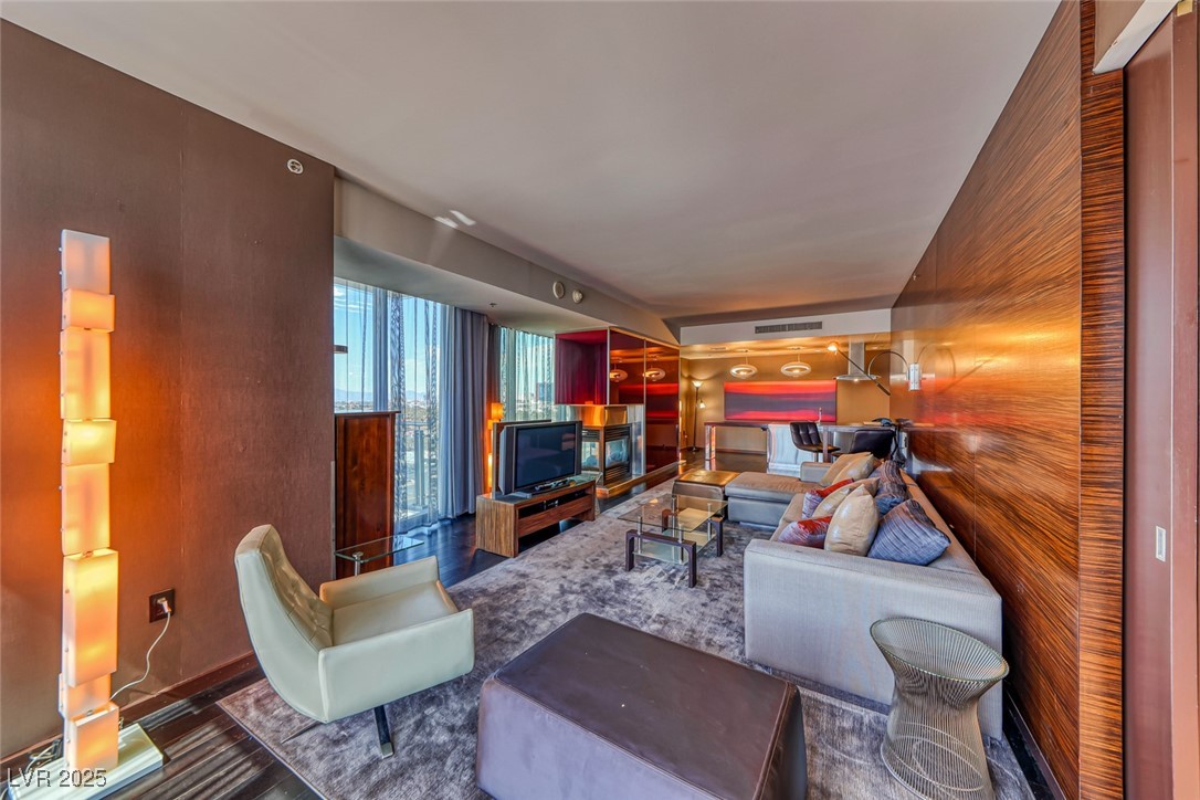 4381 West Flamingo Road, Unit 901 Las Vegas, NV 89103 - Photo 8 of 58 Living area featuring wood finished floors