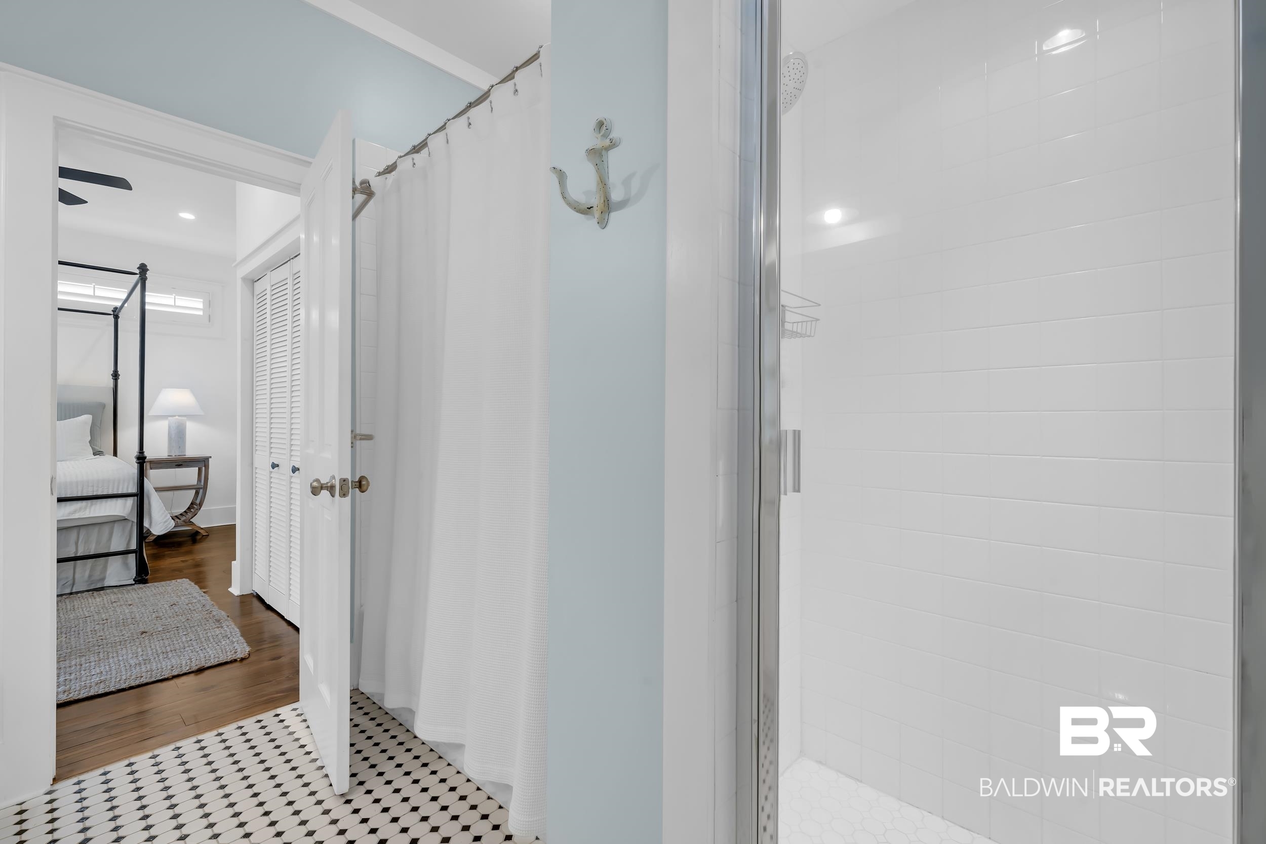 25773 Canal Road, Unit 32 Orange Beach, AL 36561 - Photo 20 of 35 Bathroom featuring a stall shower and tile patterned flooring