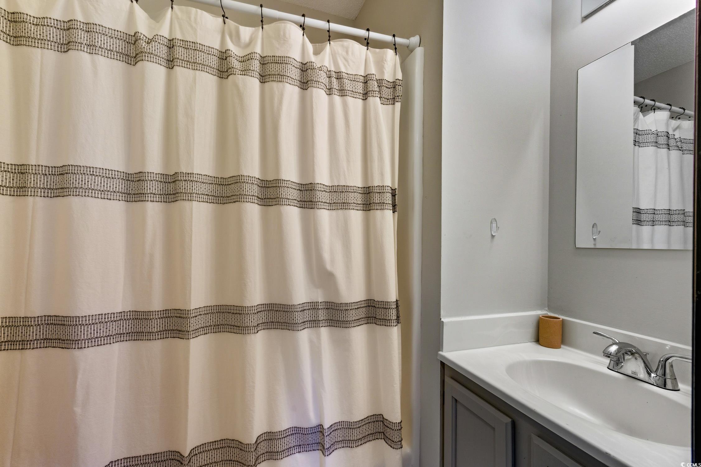 418 Chesterfield Court Myrtle Beach, SC 29577 - Photo 12 of 18 Carpeted bedroom featuring a ceiling fan and a textured ceiling