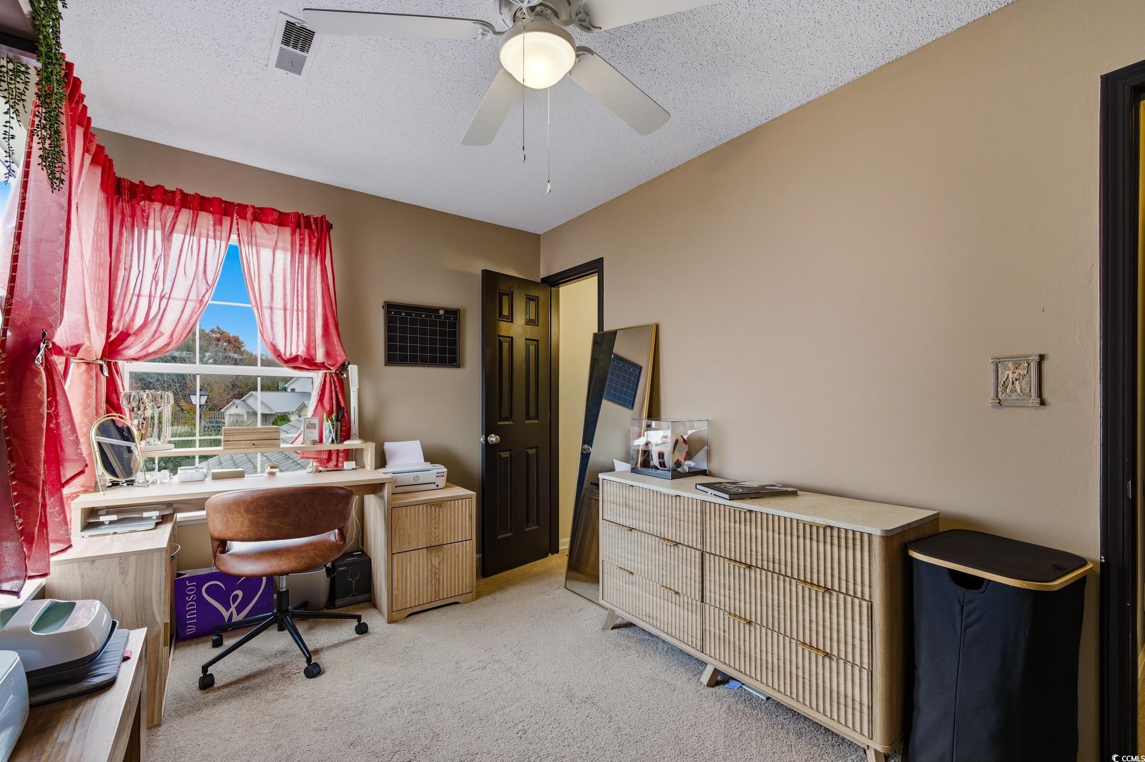 418 Chesterfield Court Myrtle Beach, SC 29577 - Photo 13 of 18 Carpeted bedroom featuring a ceiling fan and a textured ceiling