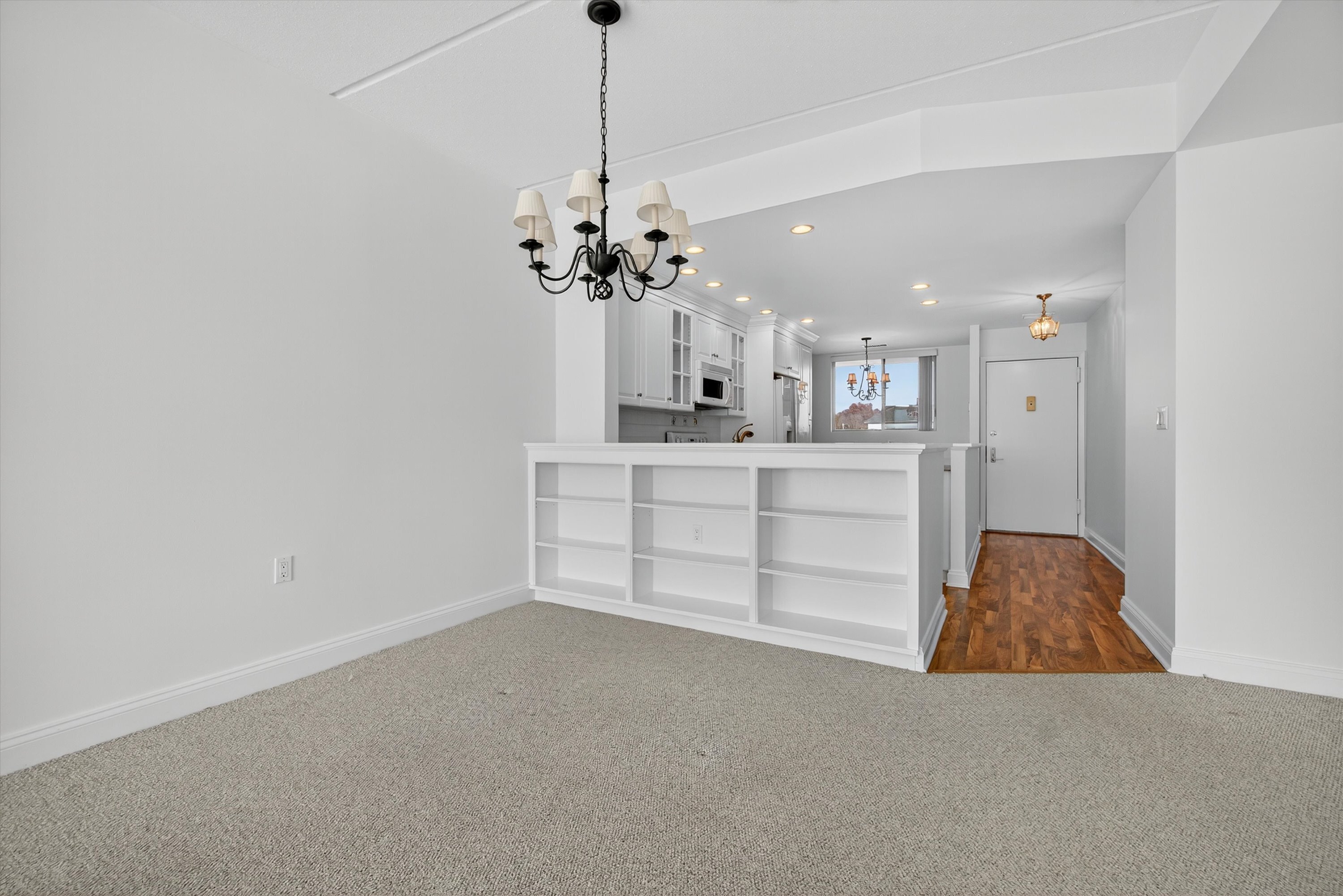 100 Seaview Avenue, Unit 3I Norwalk, CT 06855 - Photo 15 of 40 a view of a kitchen with a sink and chandelier