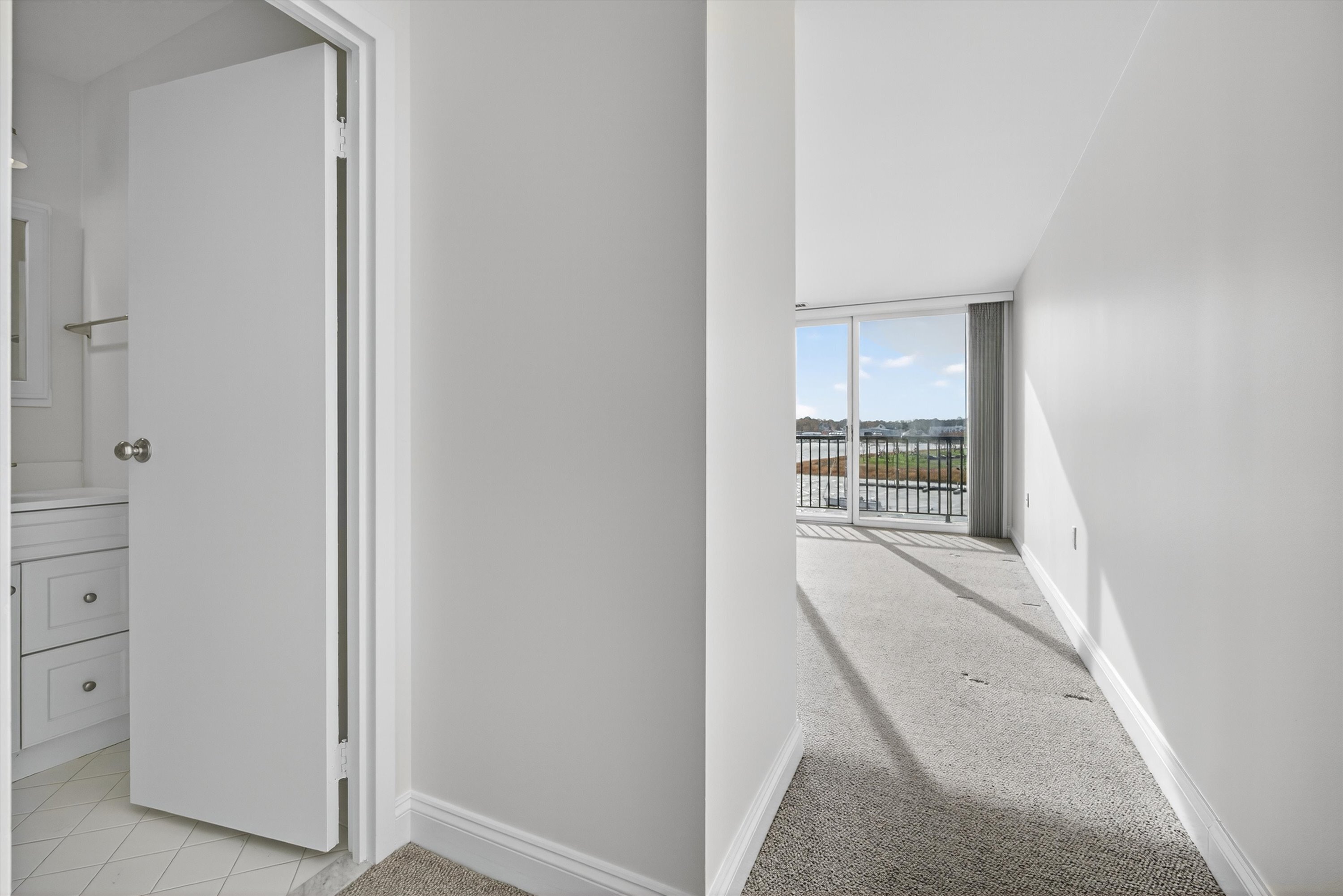 100 Seaview Avenue, Unit 3I Norwalk, CT 06855 - Photo 16 of 40 an entryway with wooden floor and cabinet