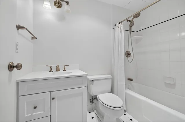 a bathroom with a sink a toilet and a bathtub
