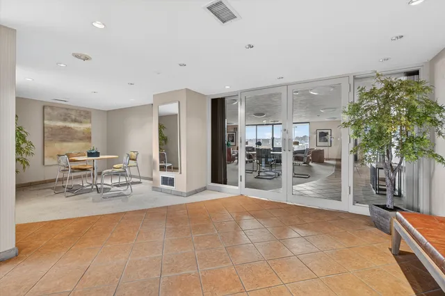 a room with lots of table and chairs