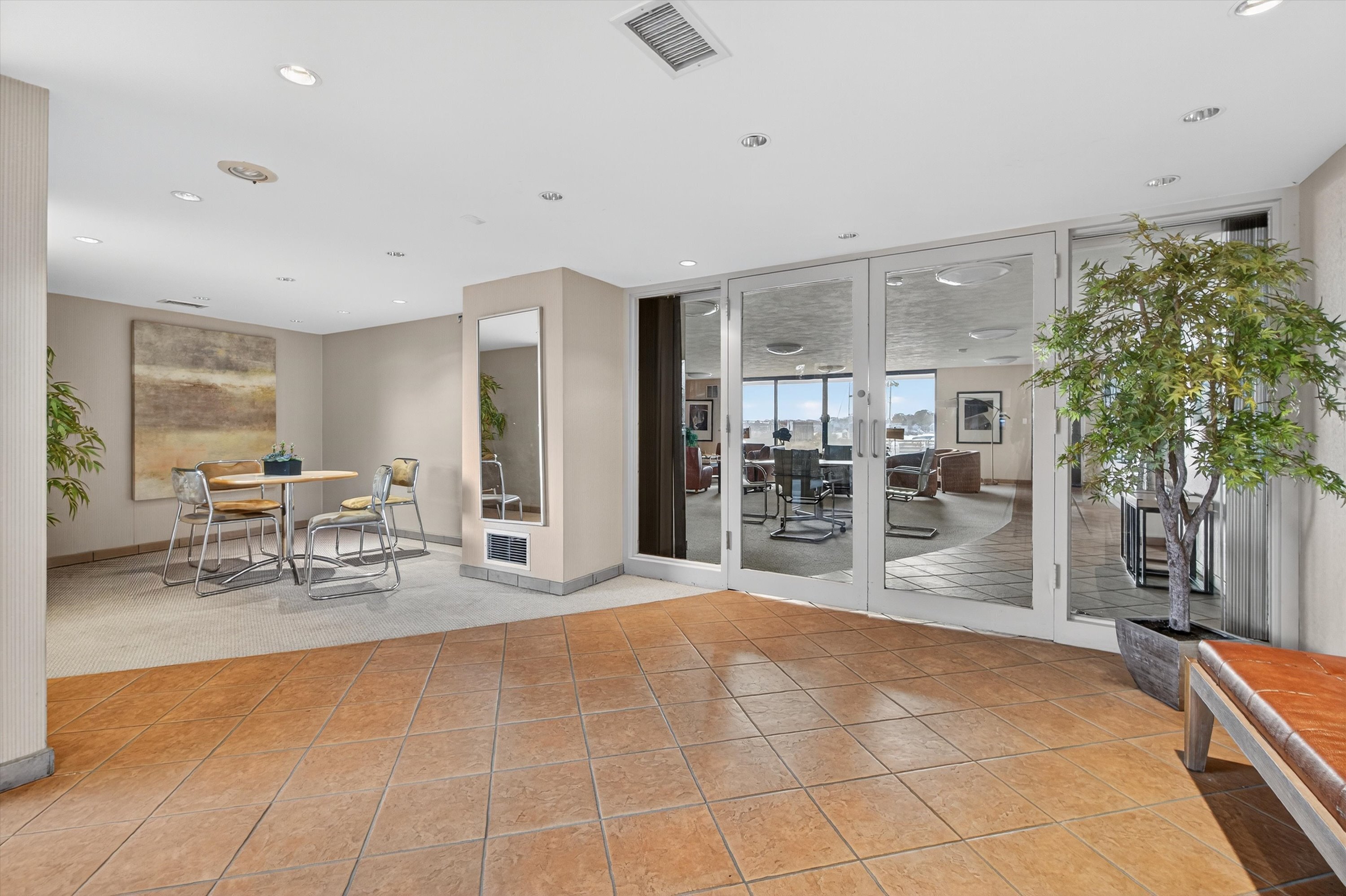 100 Seaview Avenue, Unit 3I Norwalk, CT 06855 - Photo 28 of 40 a room with lots of table and chairs