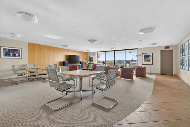 a living room with furniture a window and a table