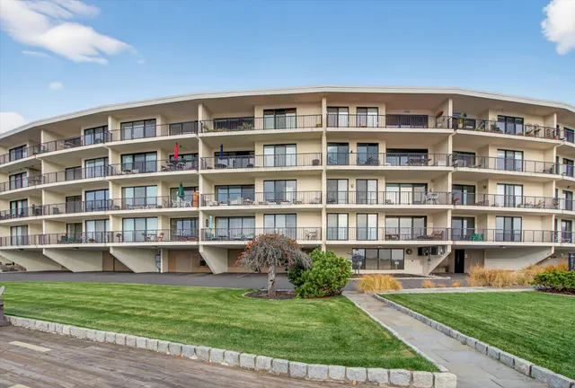 a view of a city with tall buildings and a big yard