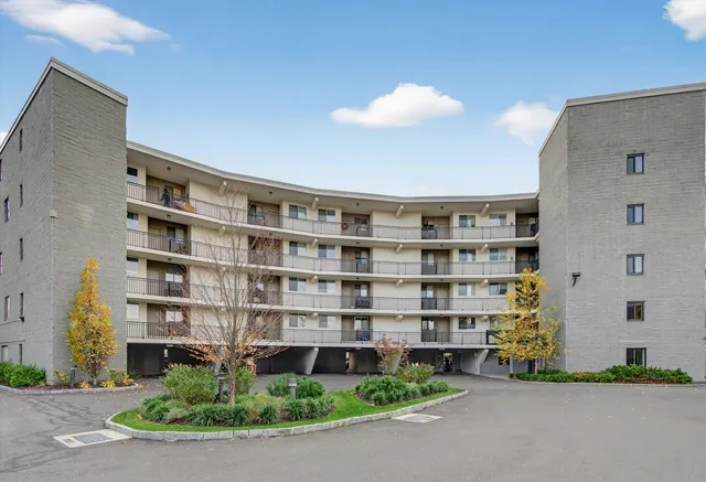 a front view of building with yard