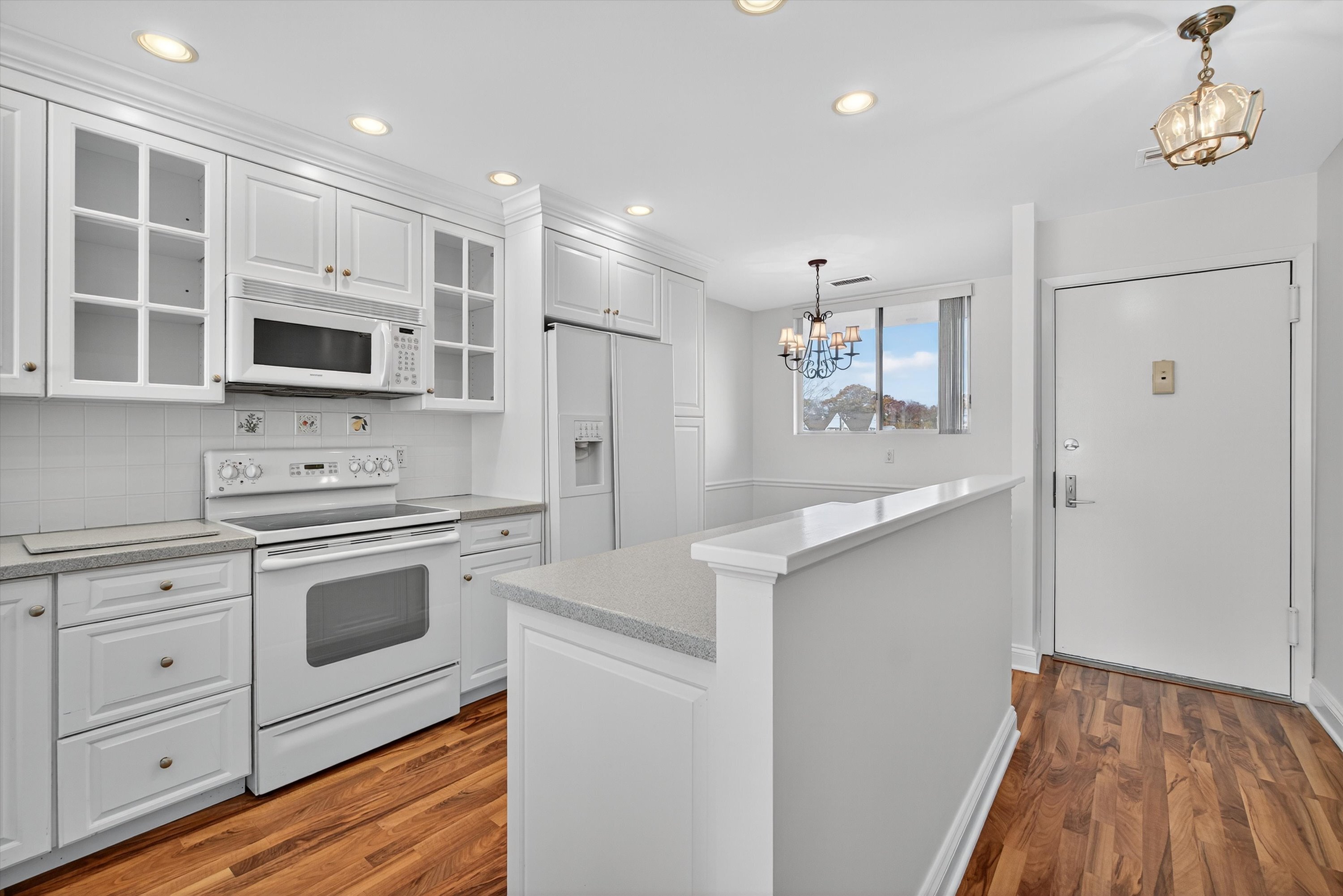 100 Seaview Avenue, Unit 3I Norwalk, CT 06855 - Photo 6 of 40 a kitchen with stainless steel appliances a stove microwave and sink