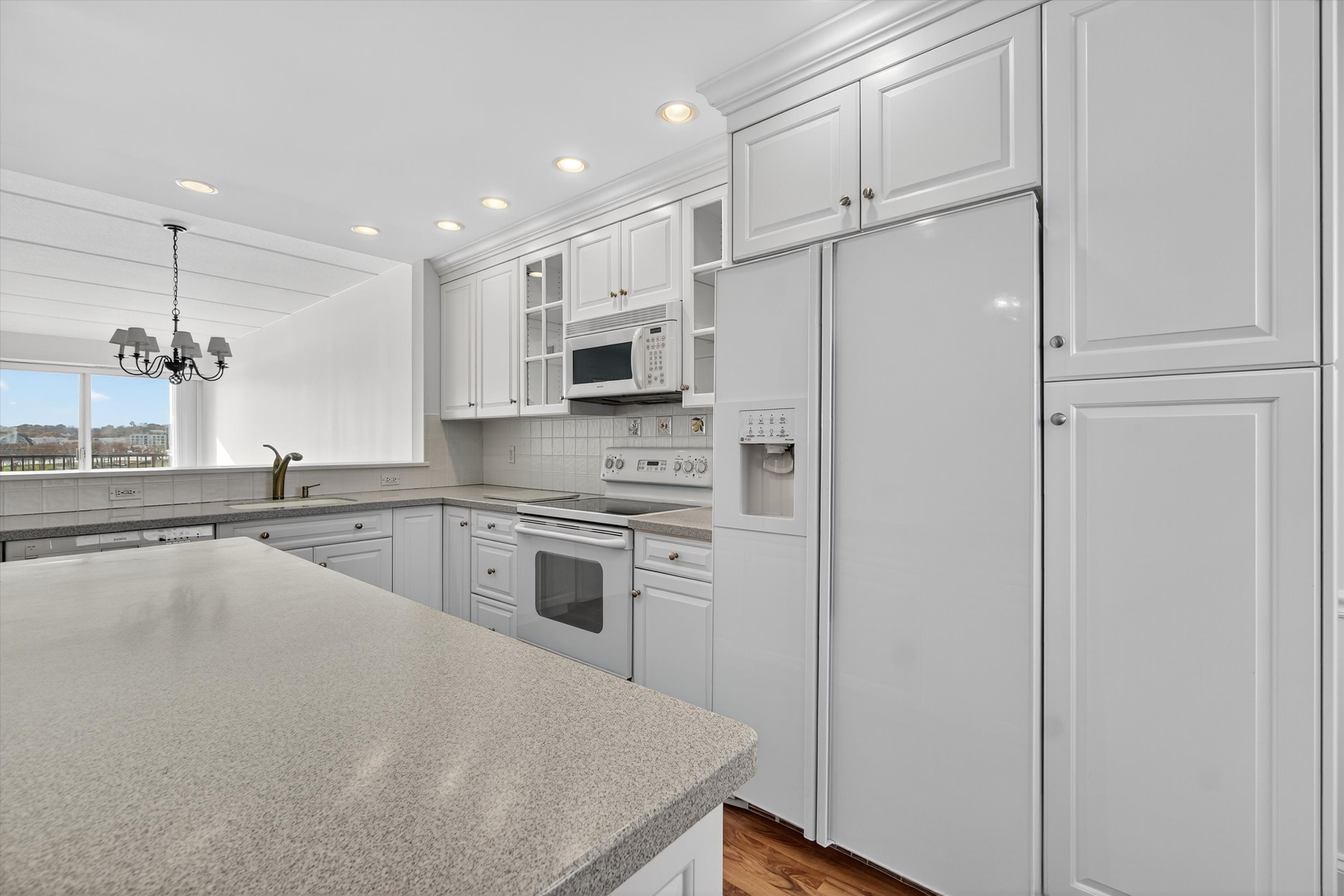 100 Seaview Avenue, Unit 3I Norwalk, CT 06855 - Photo 7 of 40 a kitchen with stainless steel appliances a refrigerator sink and microwave