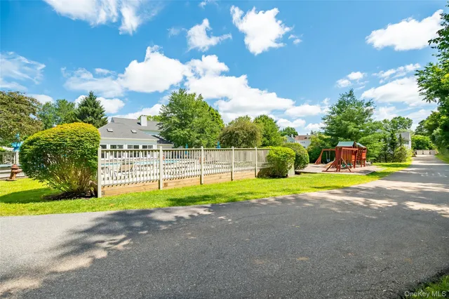 an aerial view of a house with a swimming pool