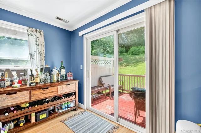 a room with lots of furniture and a large window