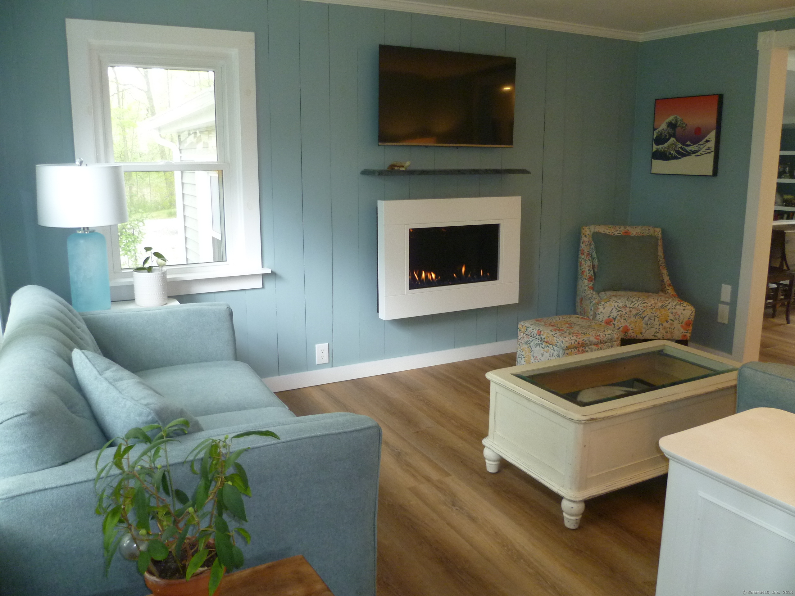 6 Sunset Lane Clinton, CT 06413 - Photo 13 of 27 a living room with furniture and a fireplace