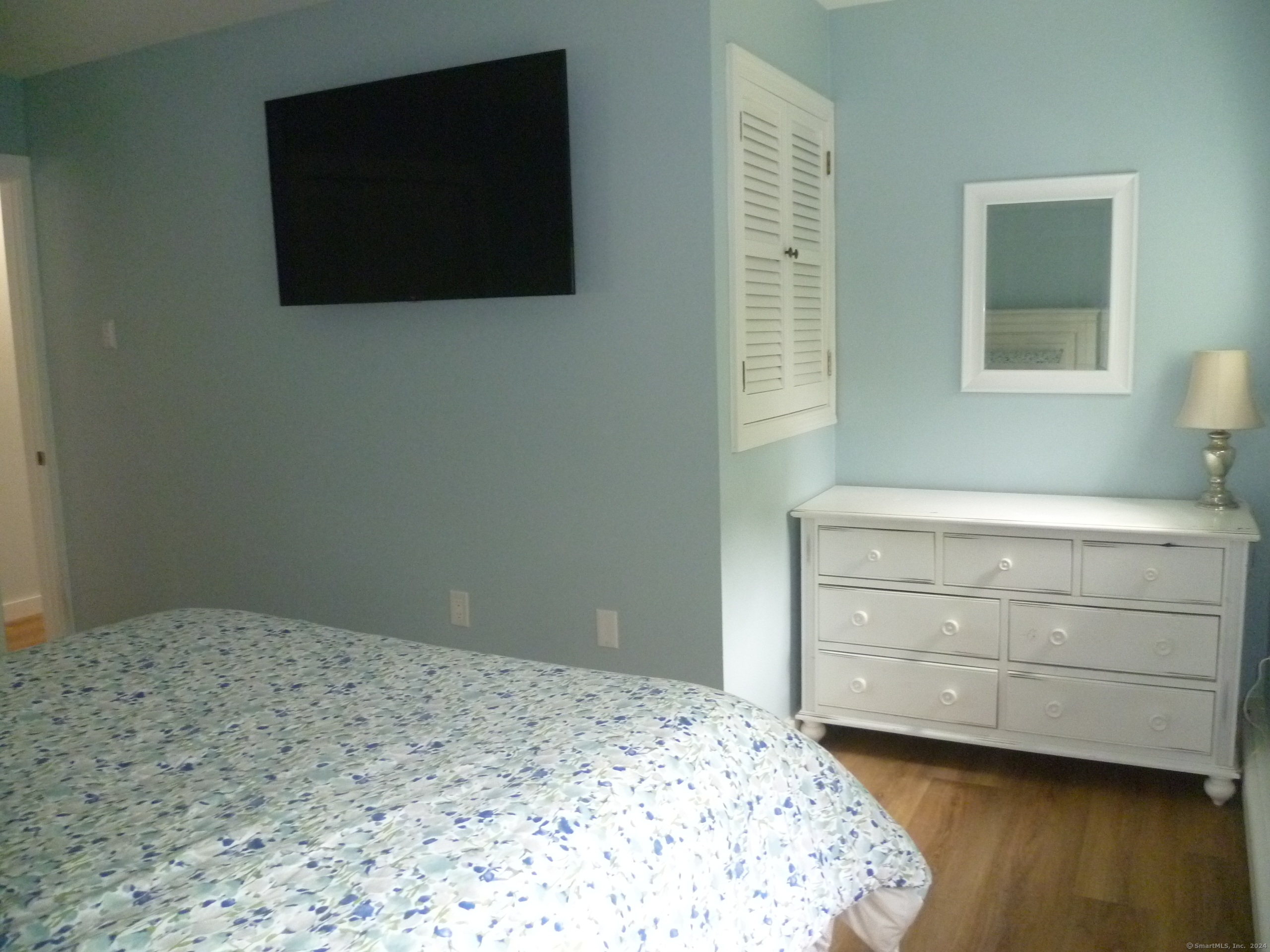 6 Sunset Lane Clinton, CT 06413 - Photo 14 of 27 a bedroom with a bed and a flat screen tv
