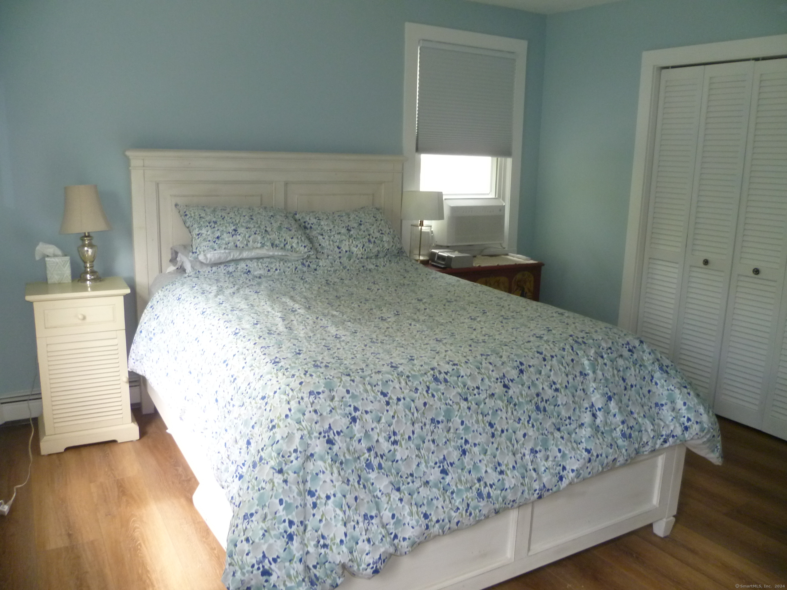 6 Sunset Lane Clinton, CT 06413 - Photo 15 of 27 a bedroom with a bed and a mirror