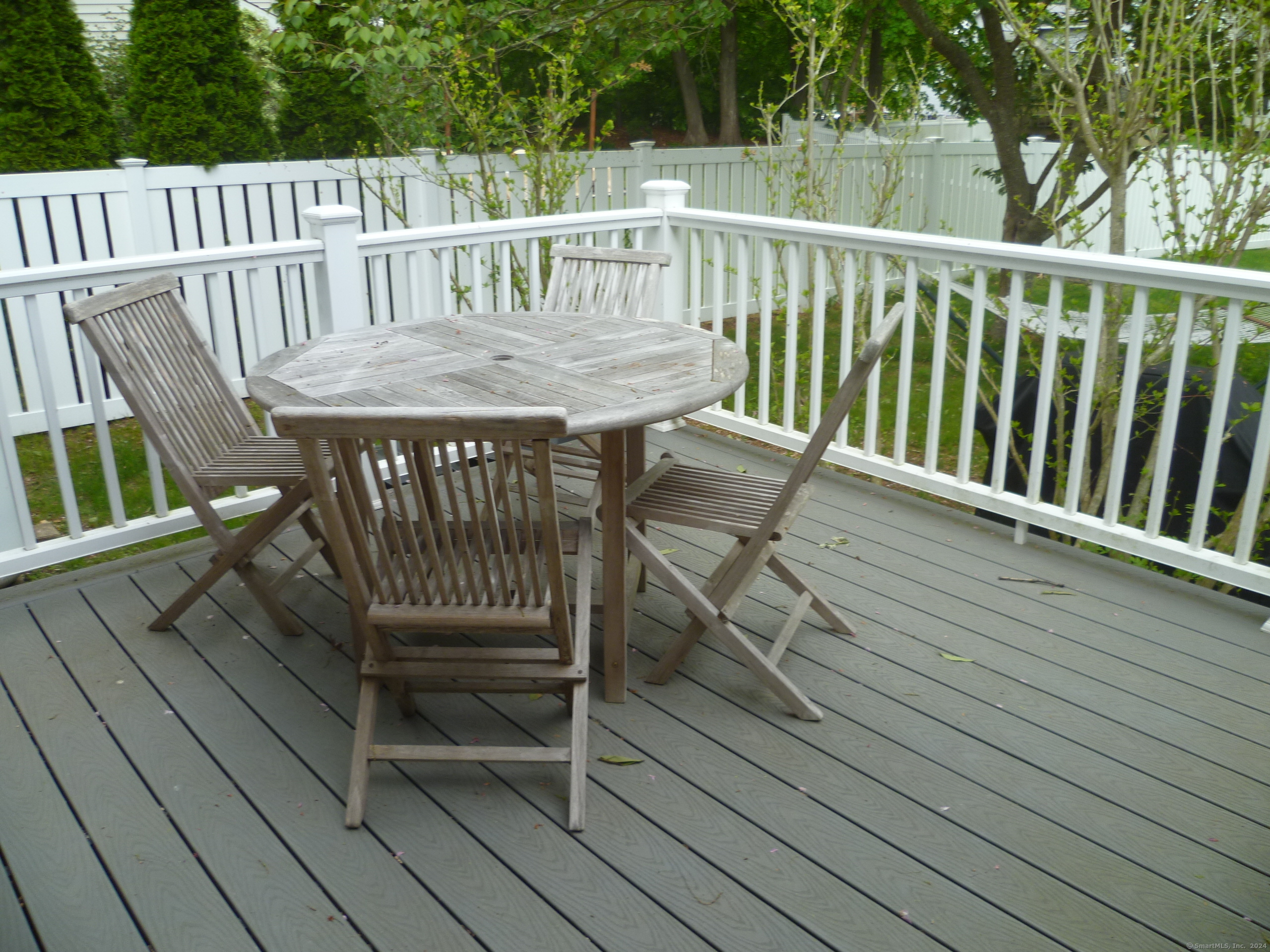 6 Sunset Lane Clinton, CT 06413 - Photo 4 of 27 a view of a wooden chairs on deck