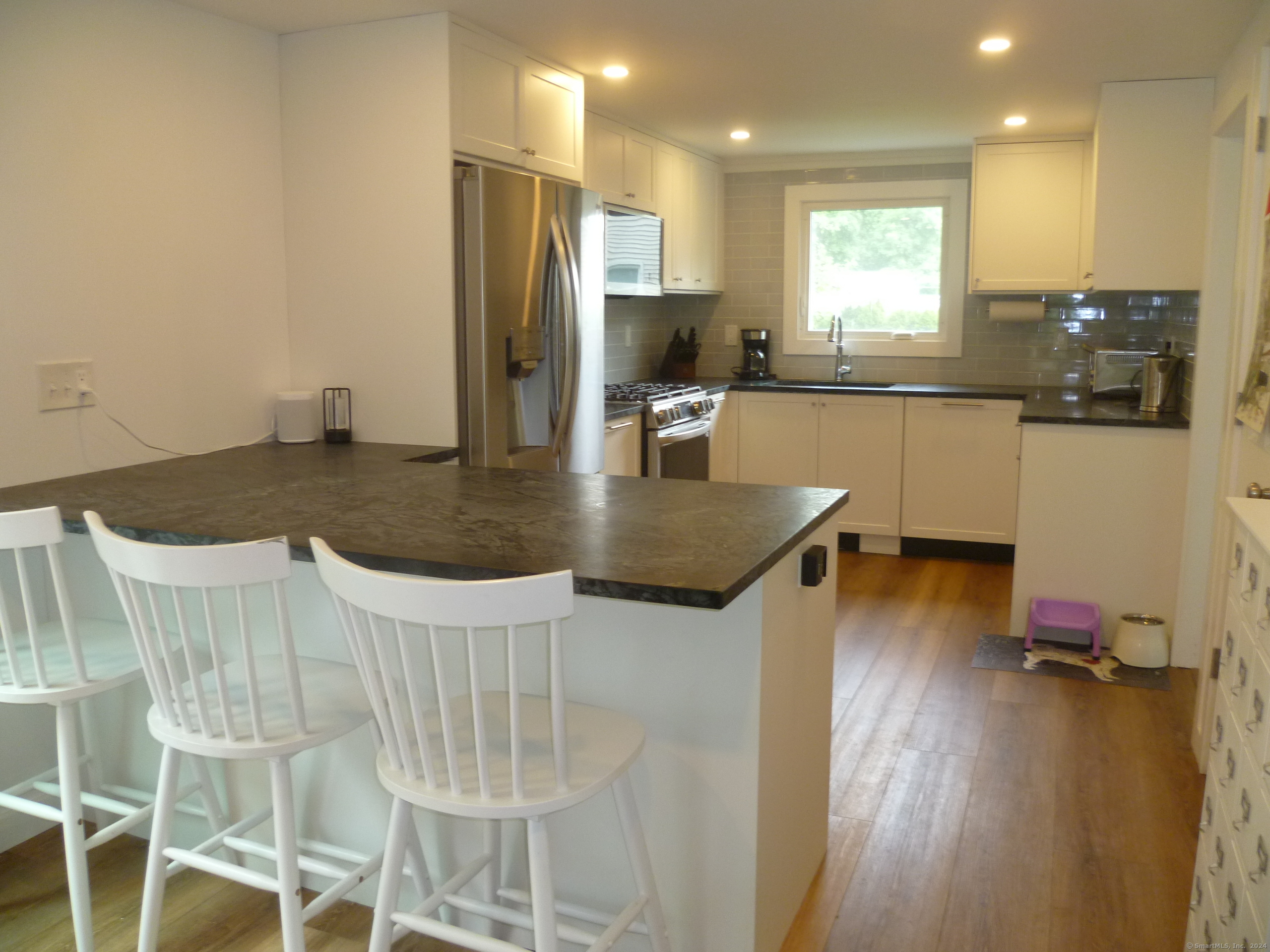 6 Sunset Lane Clinton, CT 06413 - Photo 5 of 27 a kitchen with kitchen island a appliances a sink and cabinets
