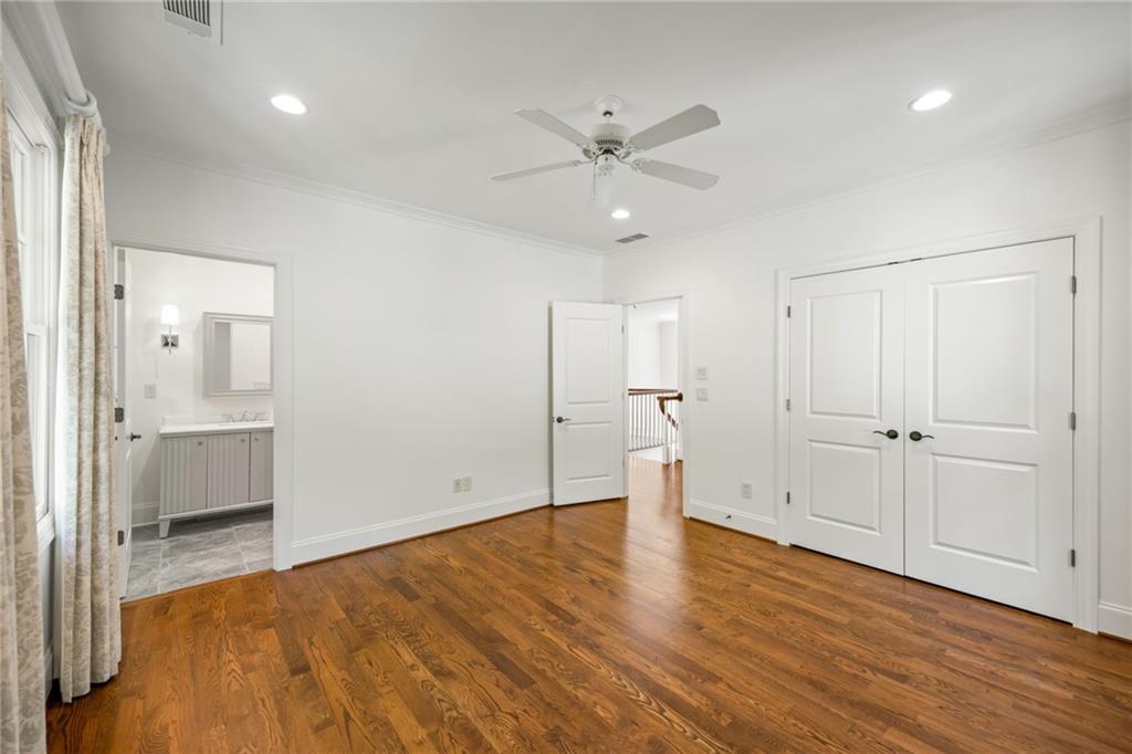 9179 Selborne Lane Chattahoochee Hills, GA 30268 - Photo 19 of 53 a view of empty room with wooden floor