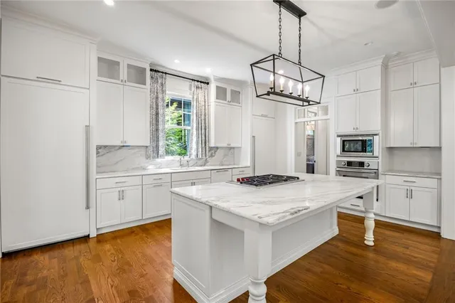 a kitchen with a sink stove and refrigerator