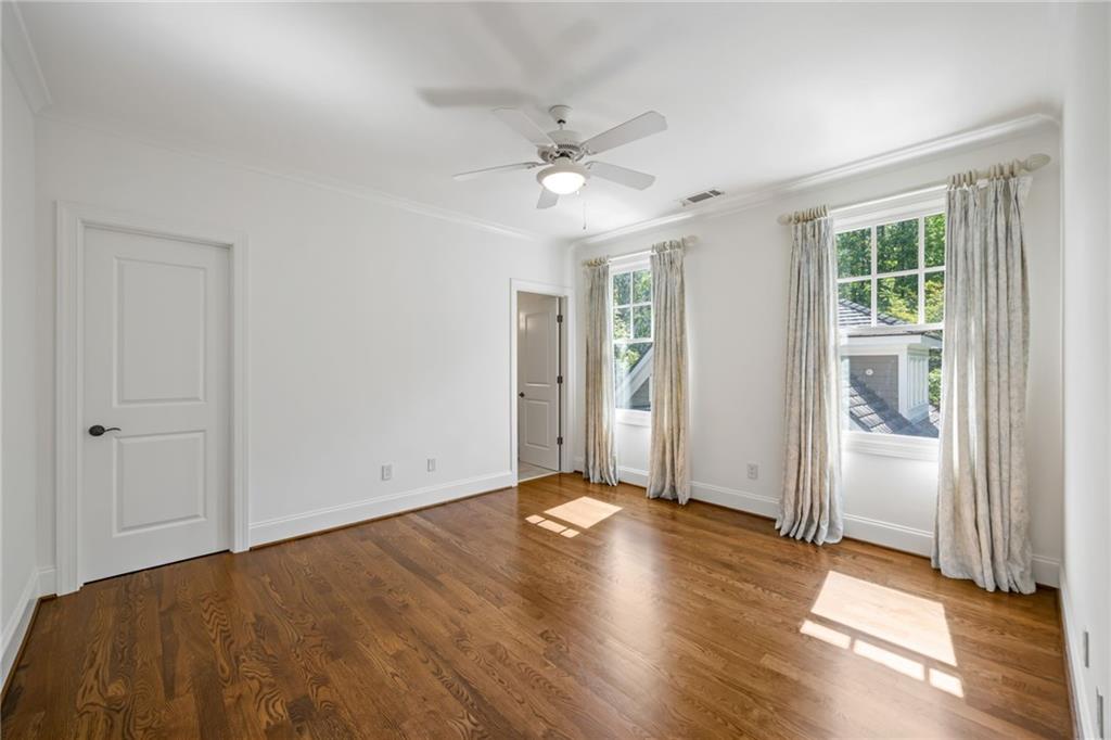 9179 Selborne Lane Chattahoochee Hills, GA 30268 - Photo 24 of 53 wooden floor in an empty room with a window