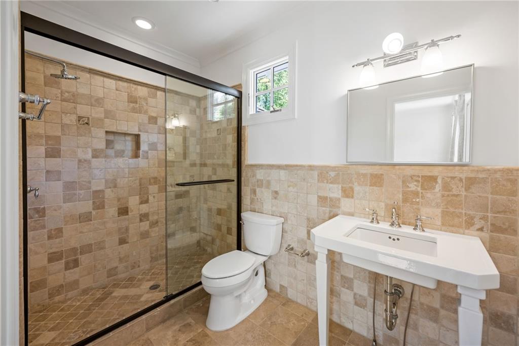 9179 Selborne Lane Chattahoochee Hills, GA 30268 - Photo 26 of 53 a bathroom with a sink toilet and shower