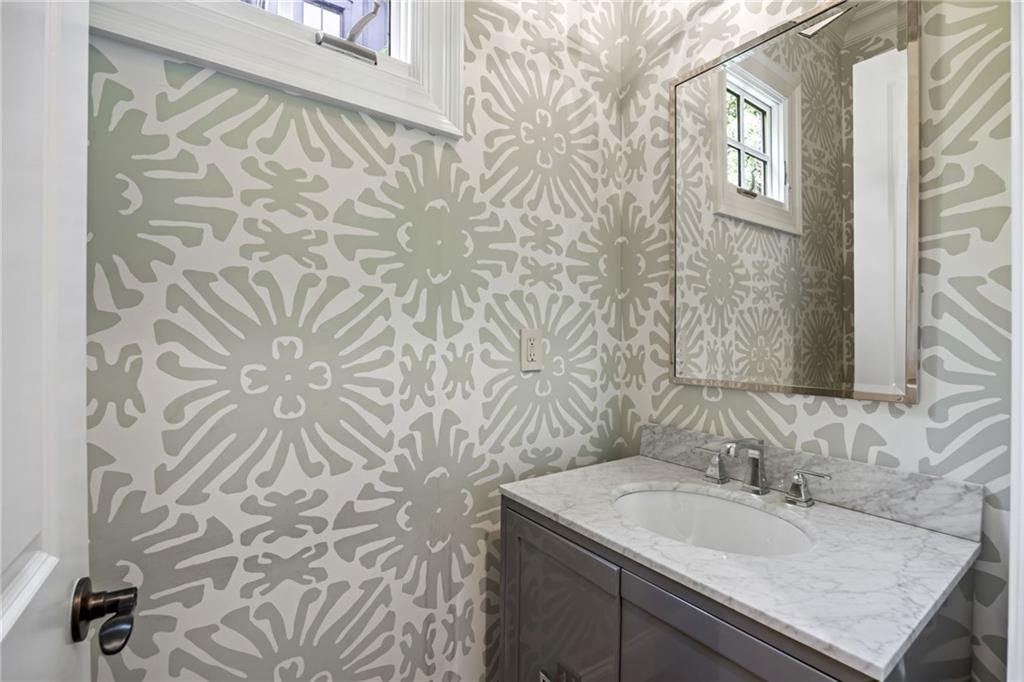 9179 Selborne Lane Chattahoochee Hills, GA 30268 - Photo 29 of 53 a bathroom with a sink and a mirror