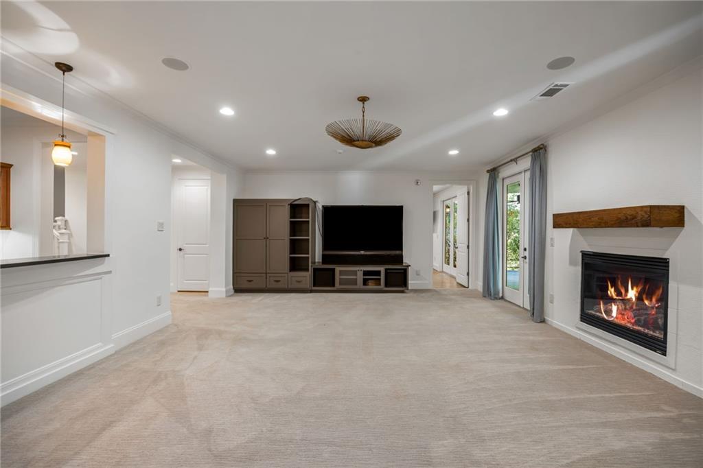 9179 Selborne Lane Chattahoochee Hills, GA 30268 - Photo 33 of 53 a view of an empty room with a fireplace and a window