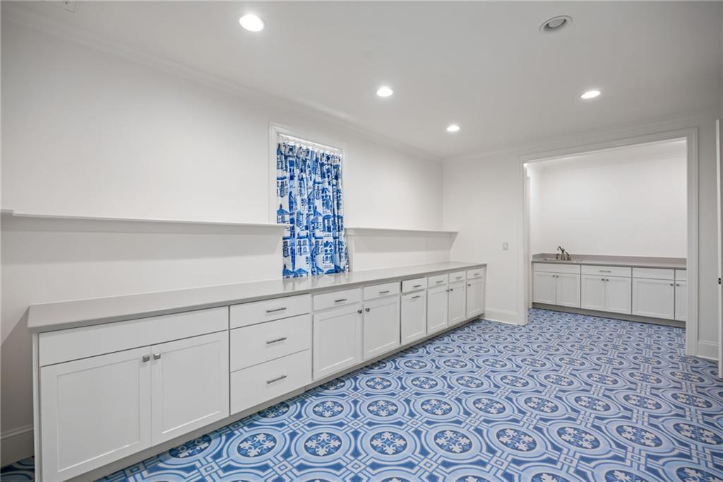 9179 Selborne Lane Chattahoochee Hills, GA 30268 - Photo 38 of 53 a spacious bathroom with a double vanity sink a mirror and a