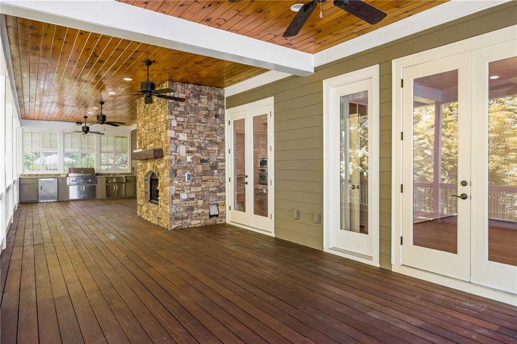 9179 Selborne Lane Chattahoochee Hills, GA 30268 - Photo 42 of 53 a view of empty room with wooden floor and fan