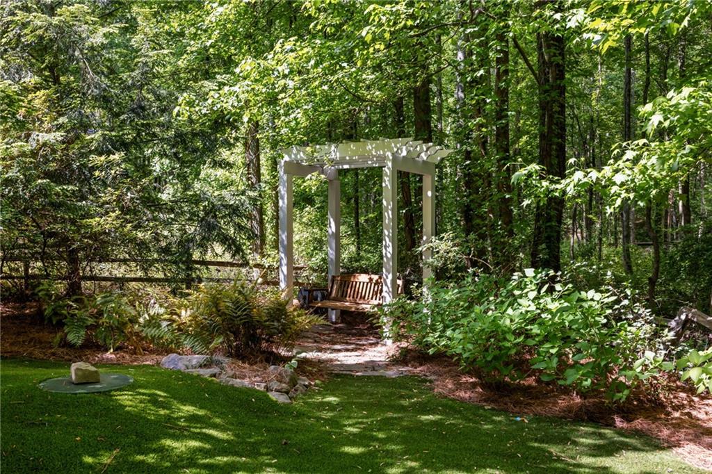9179 Selborne Lane Chattahoochee Hills, GA 30268 - Photo 46 of 53 a backyard of a house with lots of green space