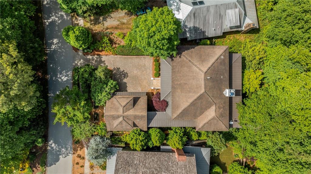 9179 Selborne Lane Chattahoochee Hills, GA 30268 - Photo 48 of 53 an aerial view of a house with a yard and wooden fence