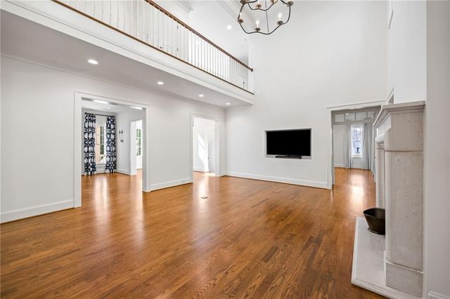 a view of a kitchen with a flat screen tv and refrigerator