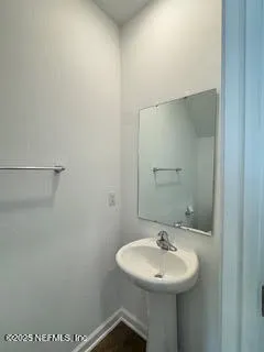 a bathroom with a toilet a sink and shower