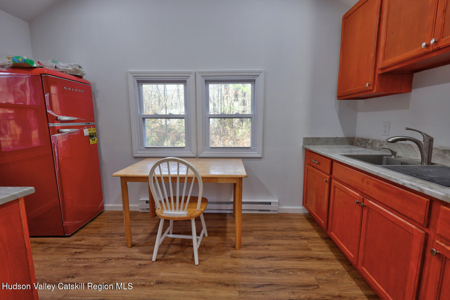 40 Cemetery Road Palenville, NY 12463 - Photo 15 of 47 a kitchen with sink wooden cabinets dining table and chairs