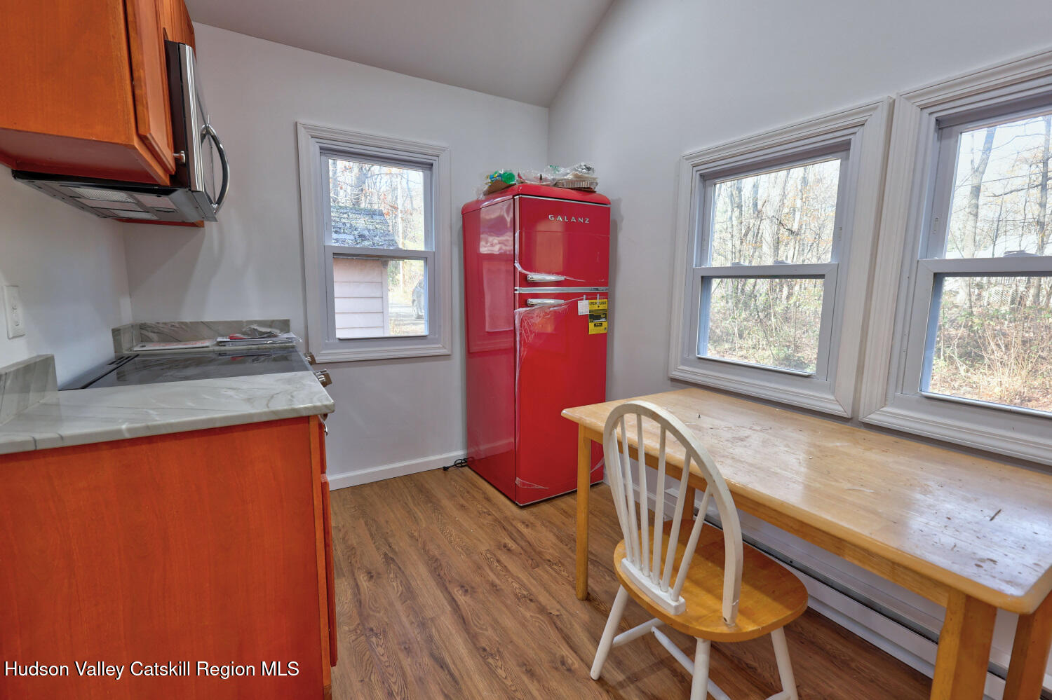 40 Cemetery Road Palenville, NY 12463 - Photo 16 of 47 a view of a kitchen with granite countertop wooden cabinets a dining table and chairs