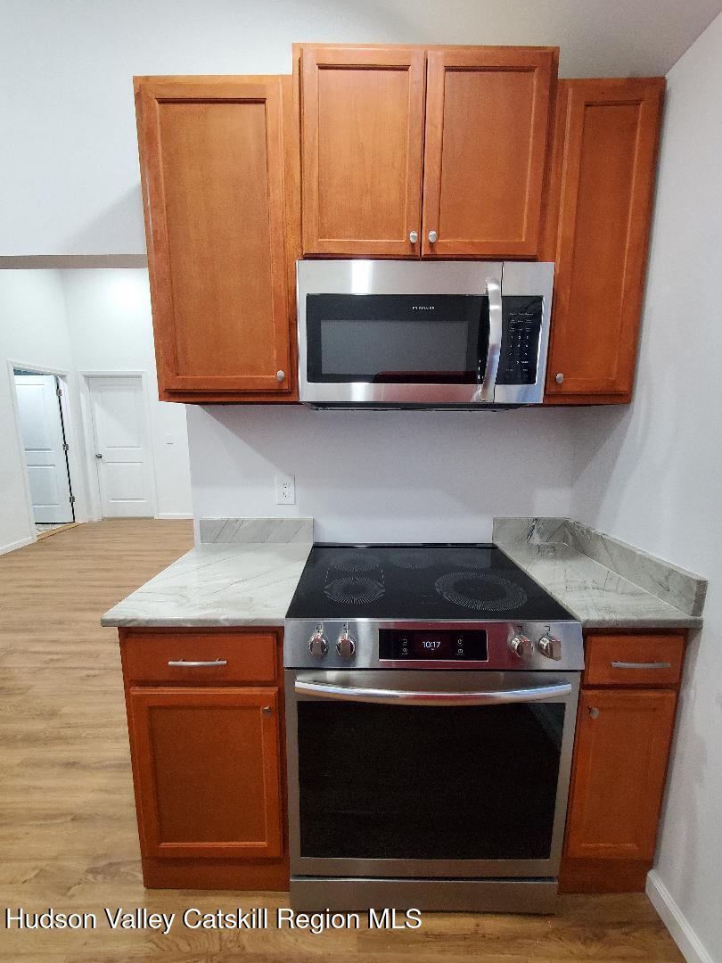40 Cemetery Road Palenville, NY 12463 - Photo 17 of 47 a stove top oven sitting inside of a kitchen