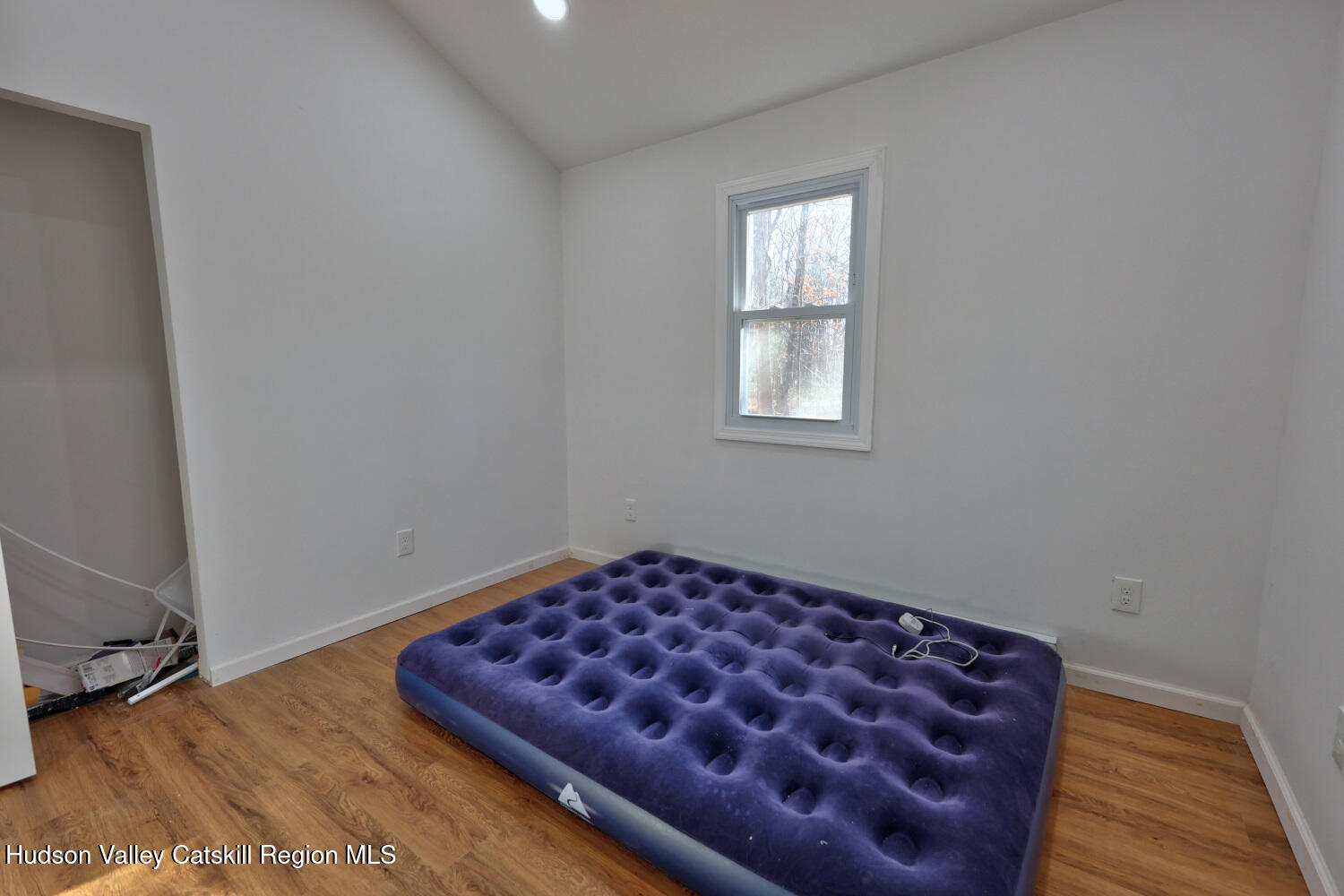 40 Cemetery Road Palenville, NY 12463 - Photo 20 of 47 an empty room with wooden floor and a window