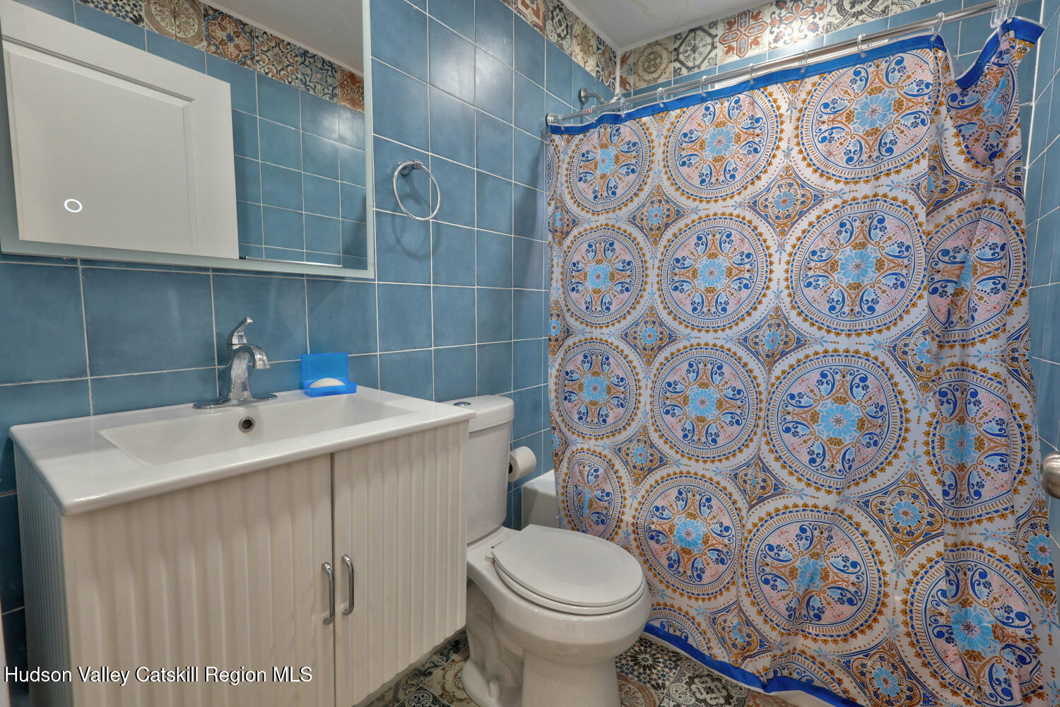 40 Cemetery Road Palenville, NY 12463 - Photo 26 of 47 a bathroom with a sink and mirror with toilet