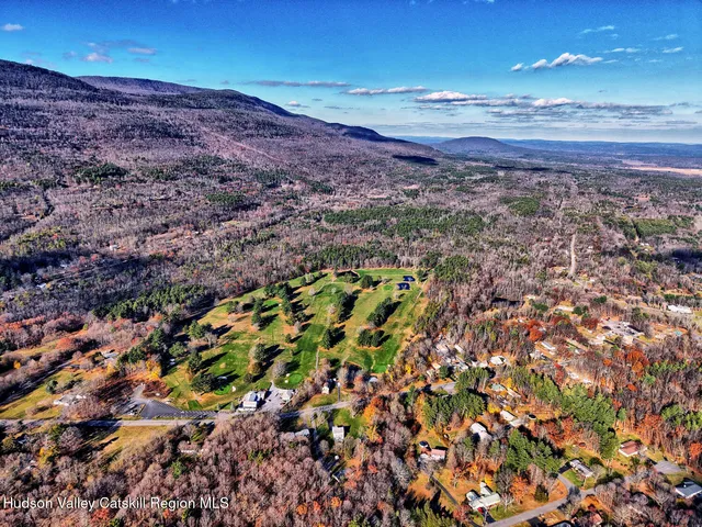 a view of a wooden door of the house