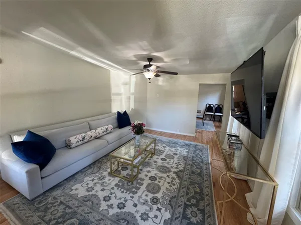 a living room with furniture and a rug